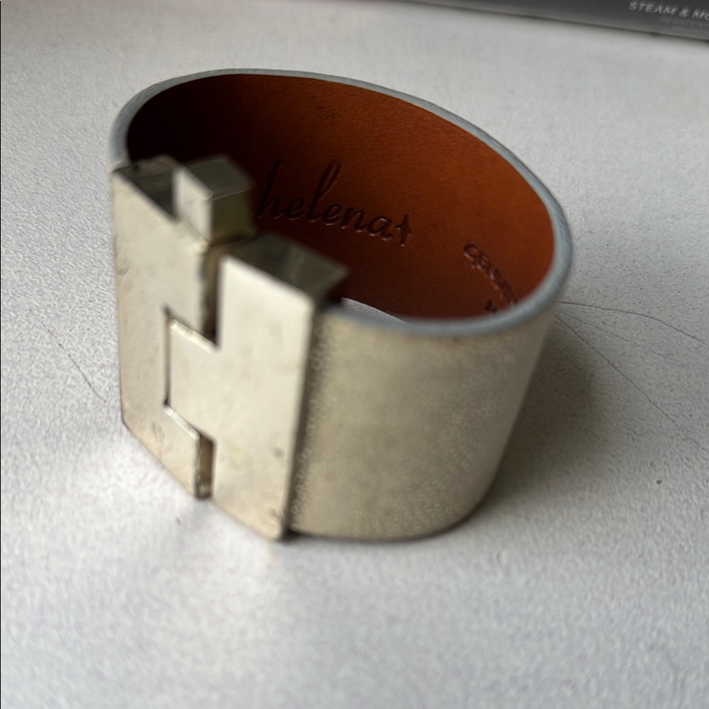 Leighelena Silver clasp metallic gold leather bracelet.